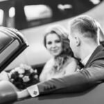 close up. happy bride and groom sitting in a luxury car. black and white photo