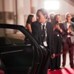 At the rally, the female bodyguard opens the car door for the politician.